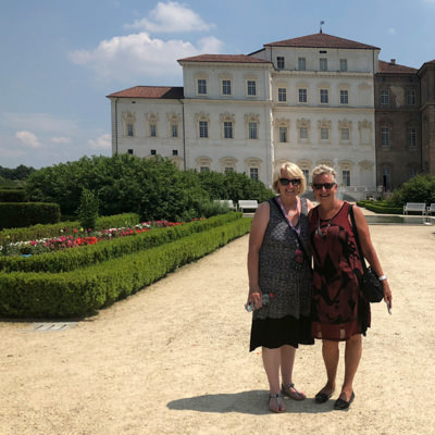 Non riding partners on a guided tour of a palace