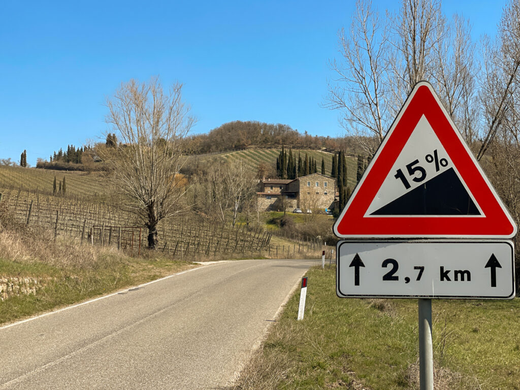 A sign in Tuscany indicating a 15% climb is approaching