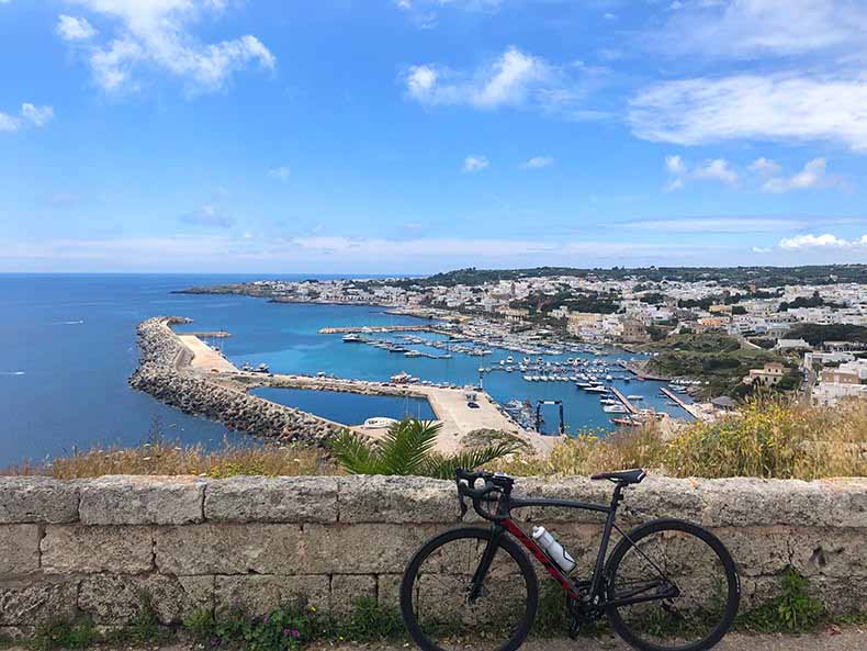 A pinarello bicycles overlooking a view of Santa Maria di Leuca