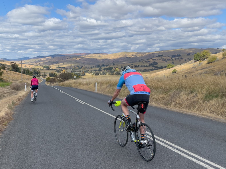 two people riding in the snowy valleys