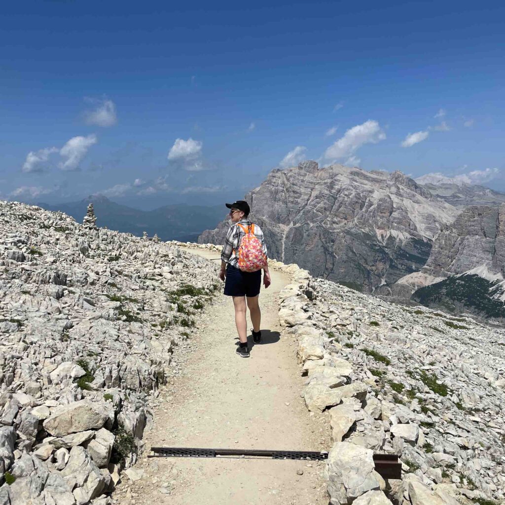 A woman hiking on an Italian cycling tour