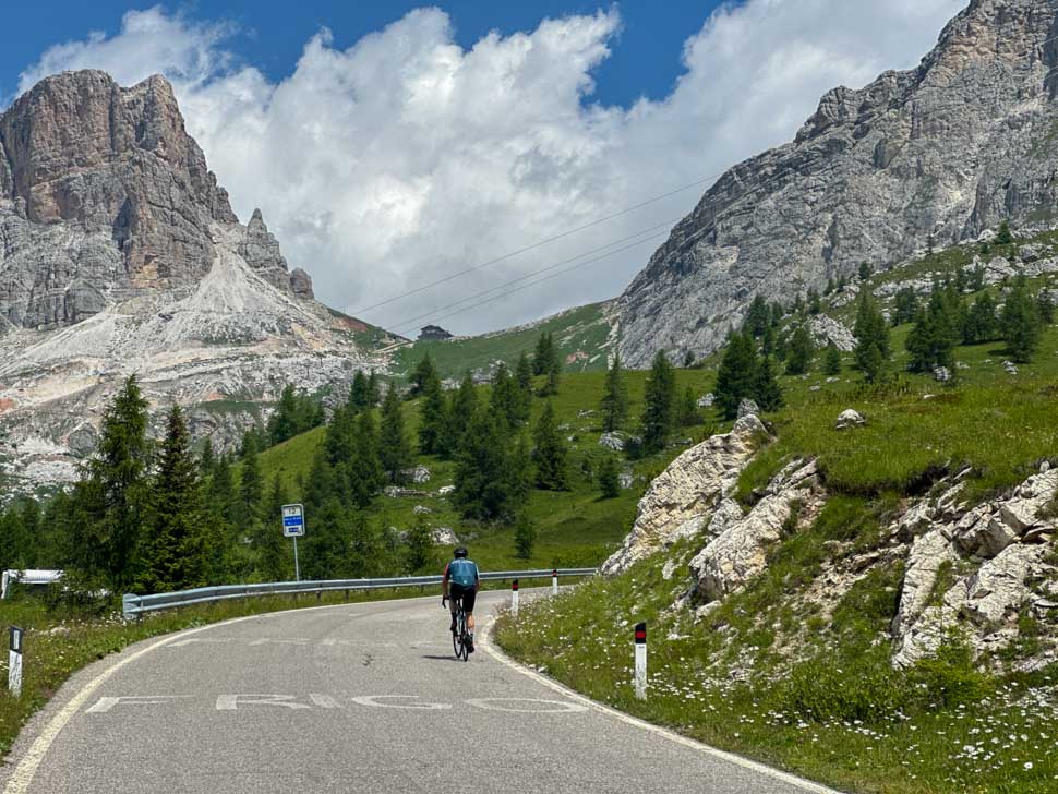 A man cycling in the Dolomites during an Italian cycling holiday