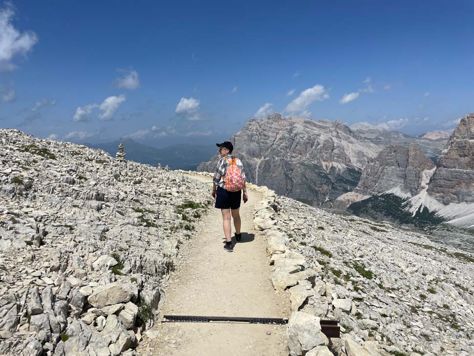 A woman hiking in the Italian mountains