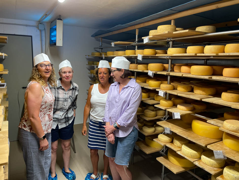 Women in a cheese room in the Dolomites