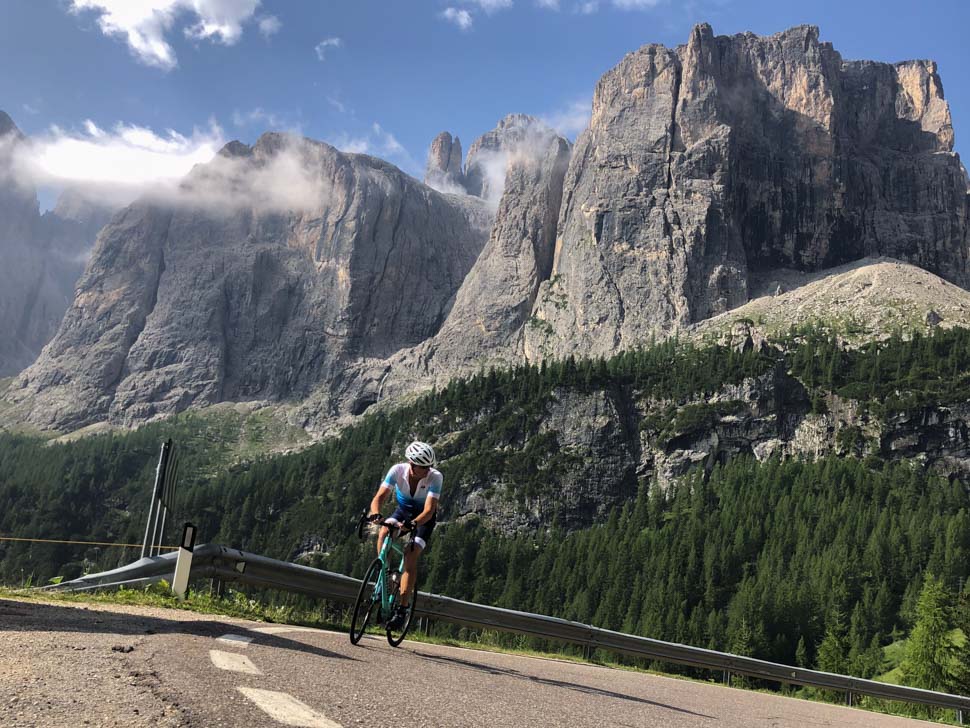 A man cycling up to Passo Gardena, Italy