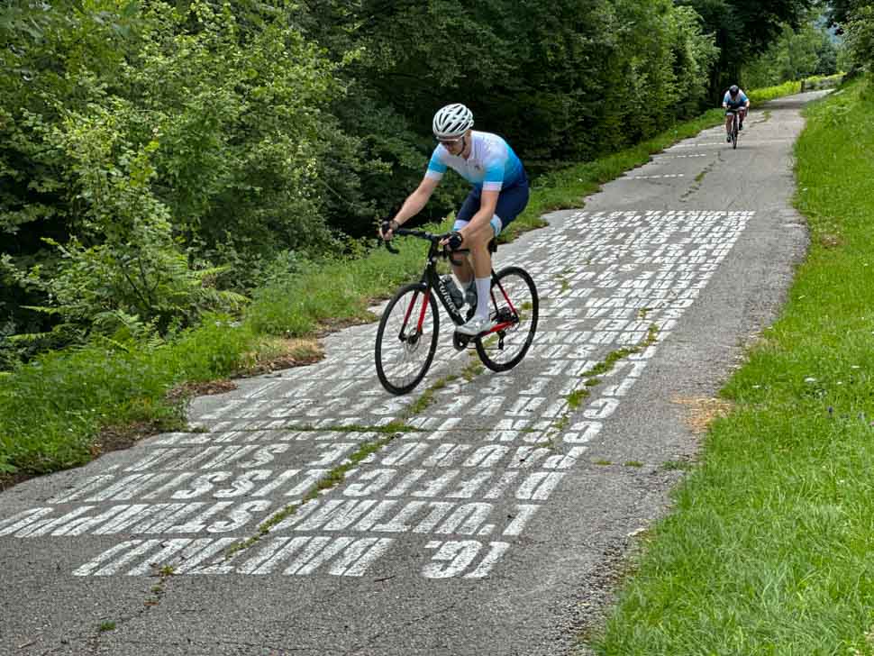 two riders cycling up the Muro di Sormano