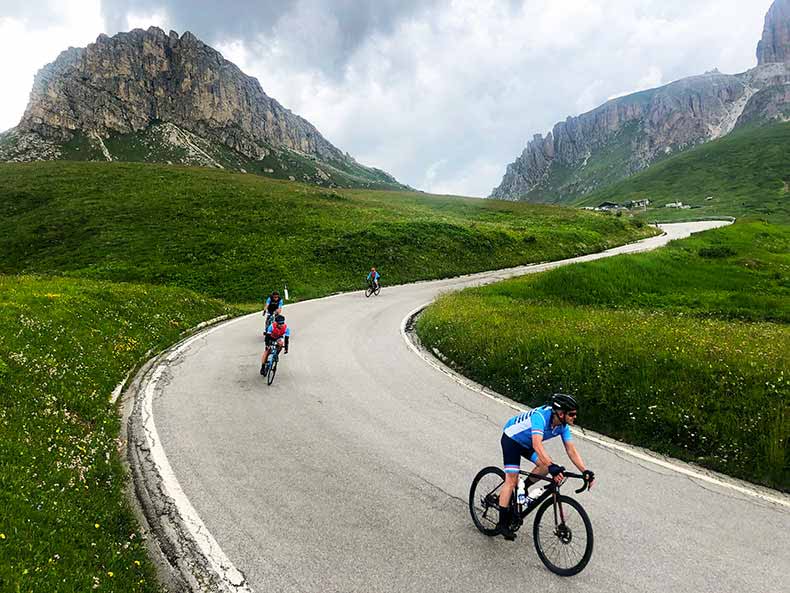 Three riders descending on the Sella Ronda route