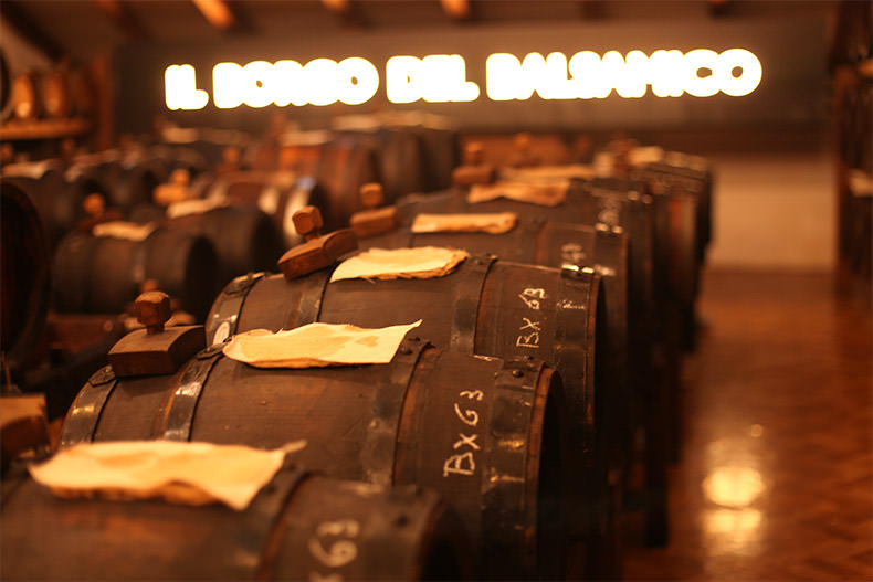 a room full of barrels of balsamic vinegar at Il Borgo del Balsamico in Emilia Romagna