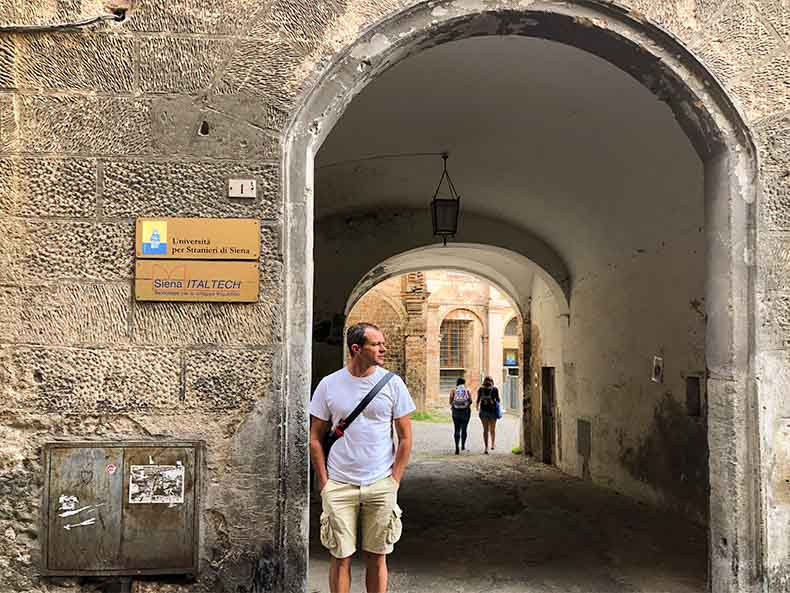 a student standing outside a language school in Italy