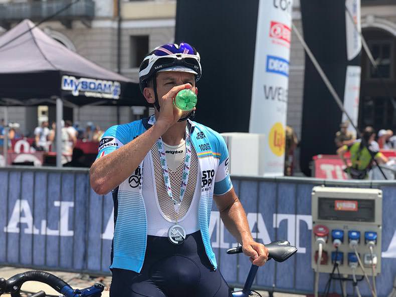 A rider drinking at the end of the La Fausto Coppi Gran Fondo