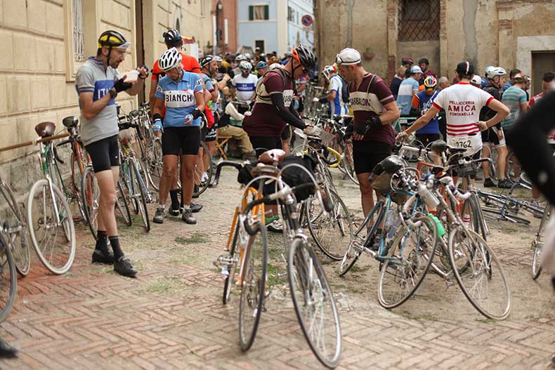 A group of riders at a rest stop during L'Eroica