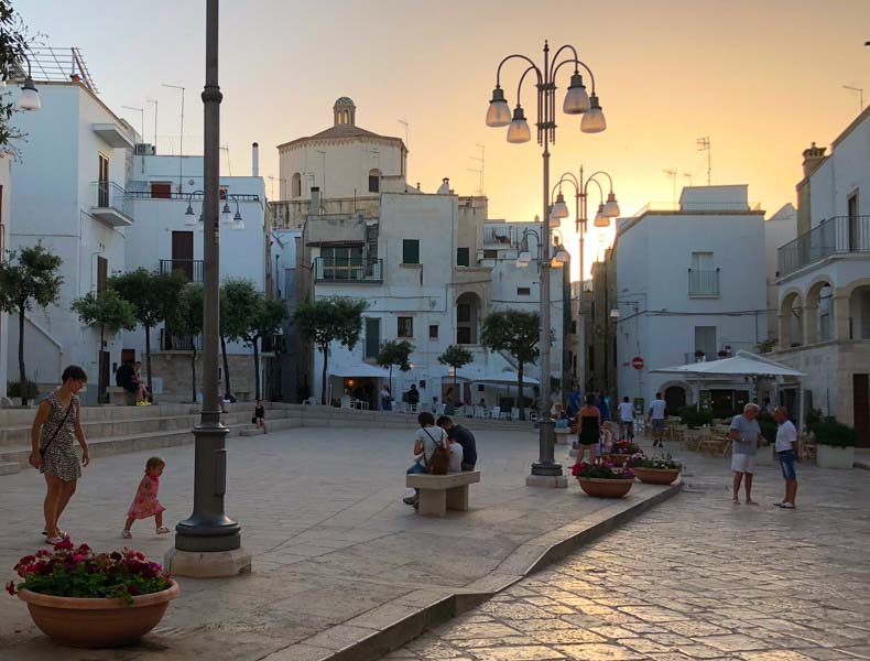 A piazza in Otranto at sunset