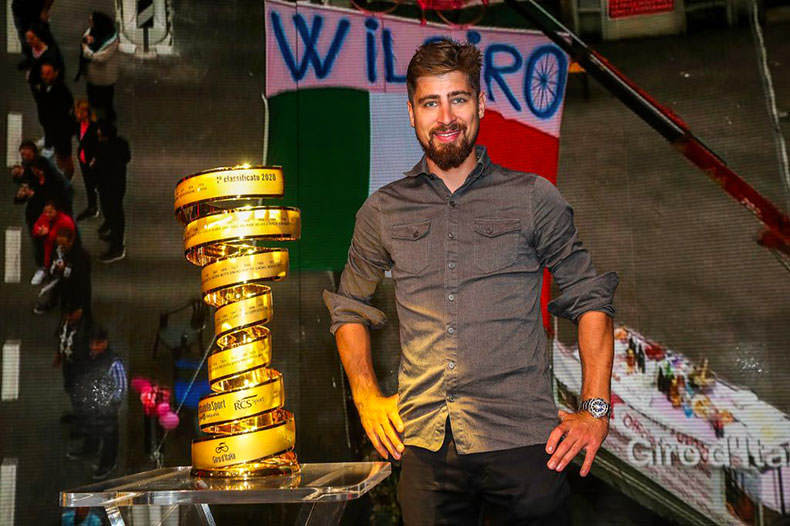 Peter Sagan standing next to the Giro Trophy