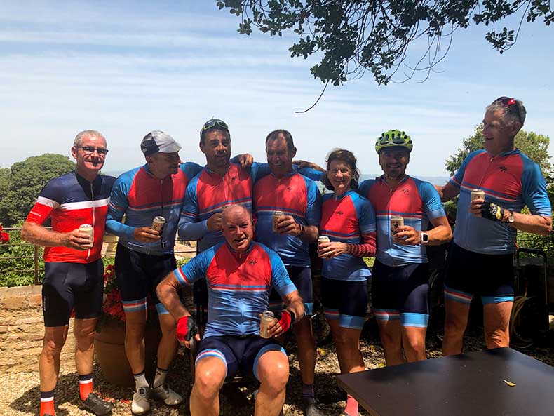 a group of cyclists having post ride beers