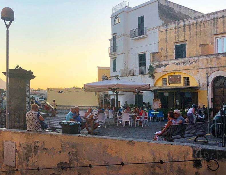 A piazza on Procida at dusk