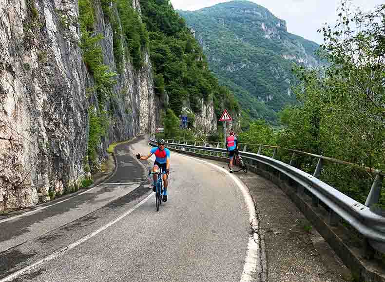 Two riders cycling around Lake Como in Italy