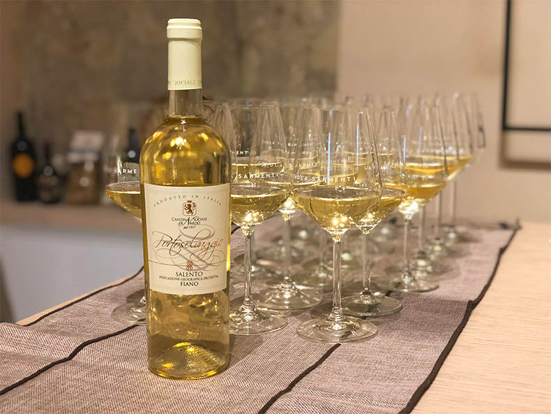 A bottle of Puglian Fiano and glasses at a tasting