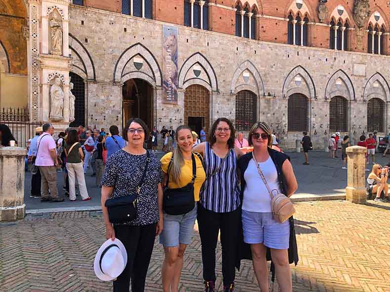 four women on a guided tour of Siena