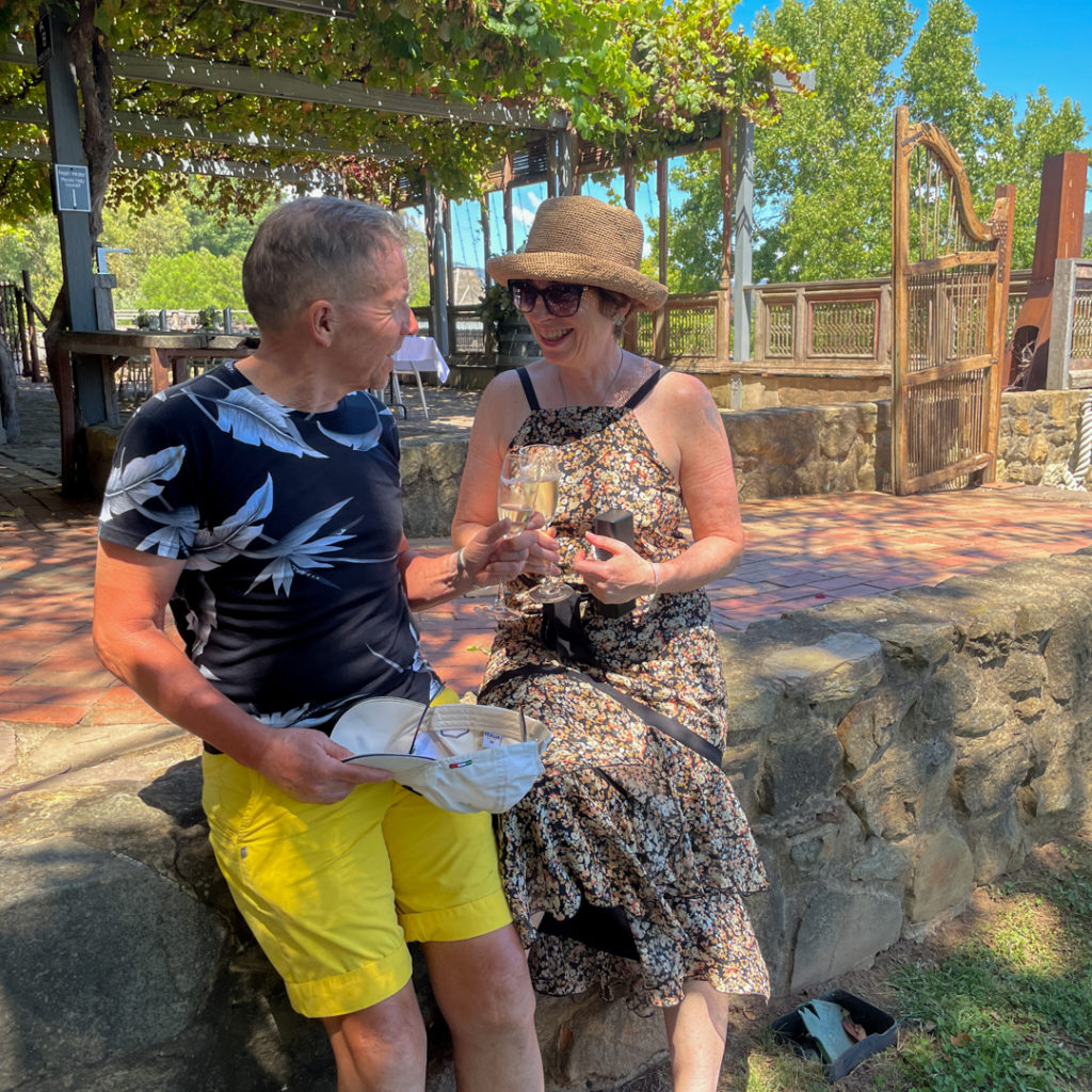 Two people drinking prosecco in the sun