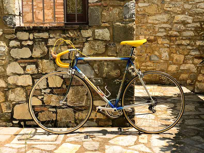 Vintage steel tommasini against a stone wall