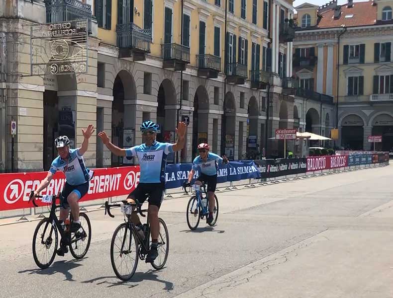Three riders approaching the finish line of La Fausto Coppi Gran fondo