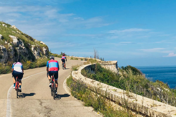 Riders cycling through coastal Puglia on holidays