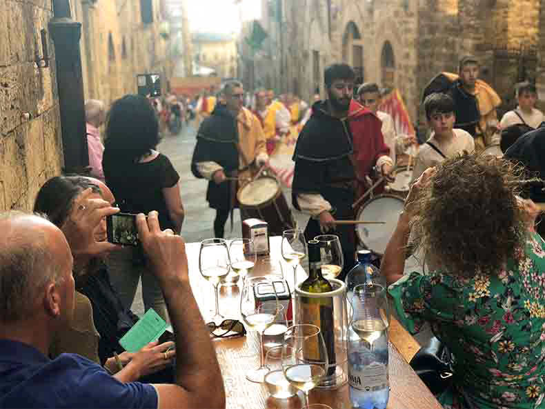 People drinking wine during aperitivo in Italy
