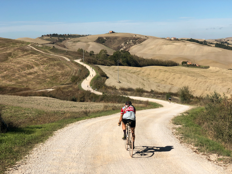 a man riding on the strade binache of Tuscany 