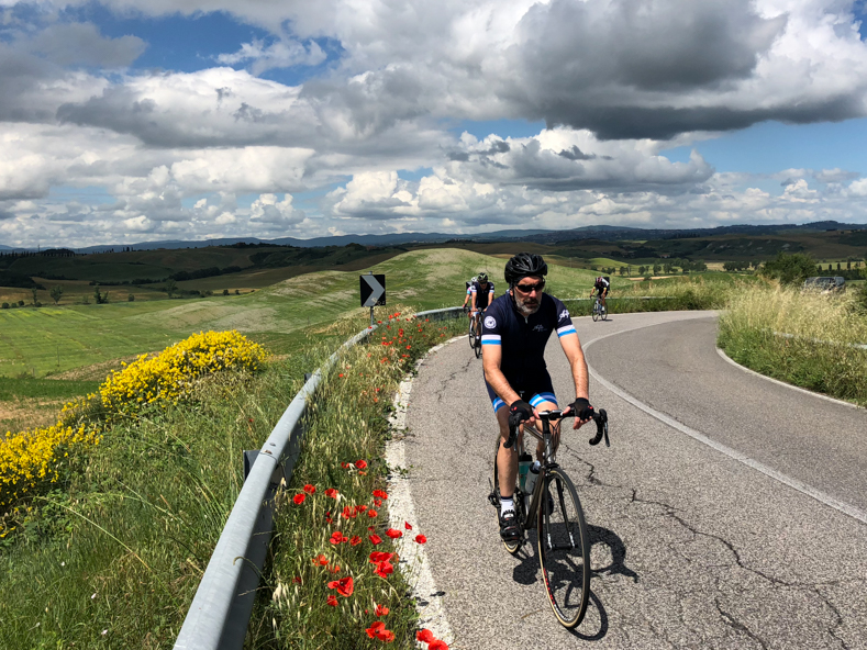 A group of riders cycling in Tuscany