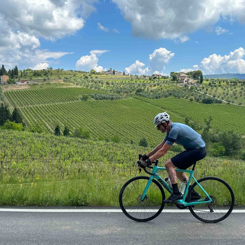 A man on a cycling holiday in Tuscany Italy