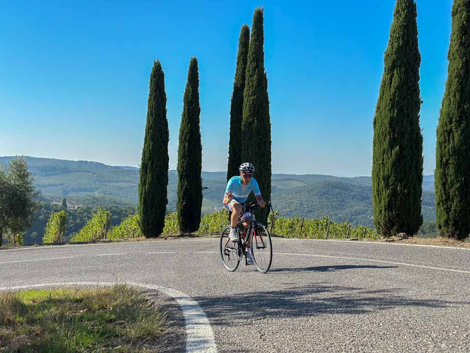 A man riding in the beautiful hills of Tuscany Italy