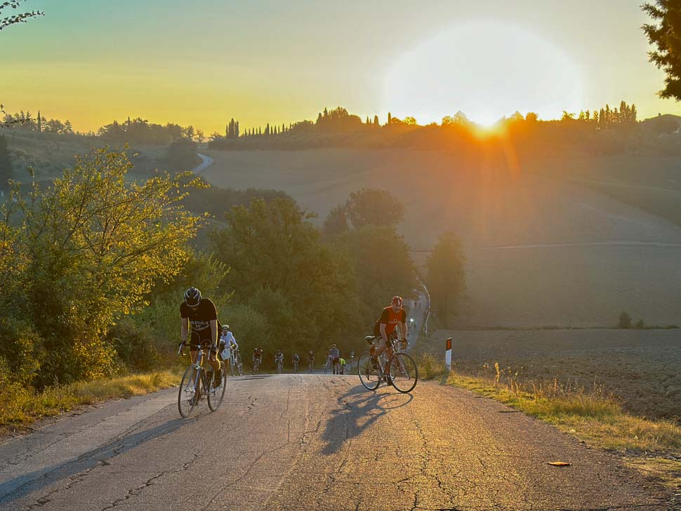 Rising at sunrise climbing a hill during L'eroica