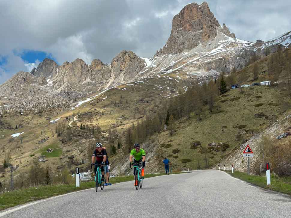 Two riders climbing up to Passo Giau in the Dolomites