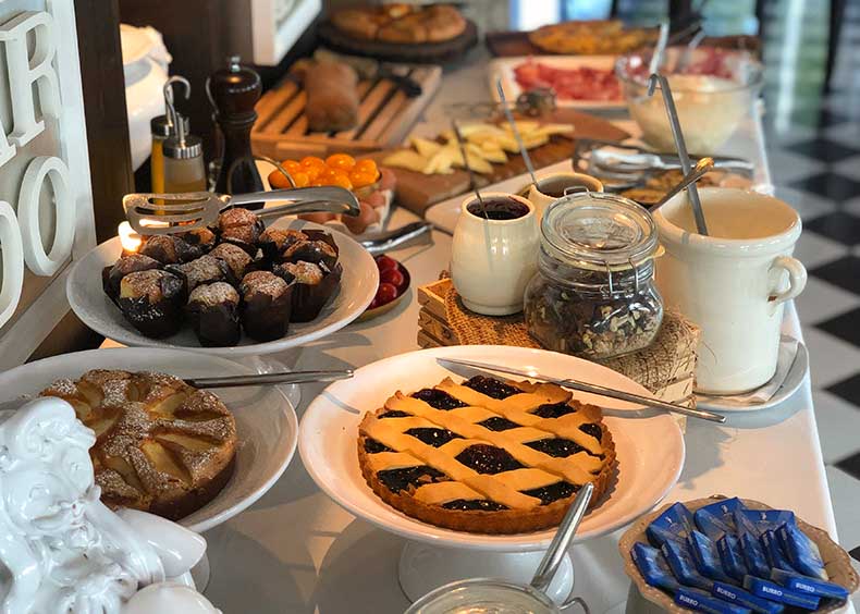 a table full of delicious Italian food for breakfast