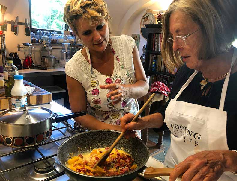 a woman cooking at a class in Piemonte