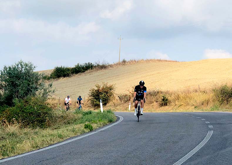 a man cycling in Tuscany