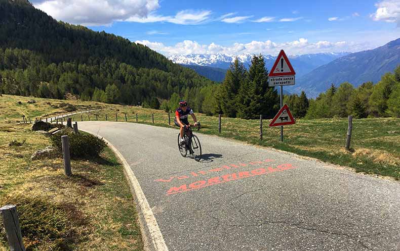 A cyclist riding to the top of Mortirolo
