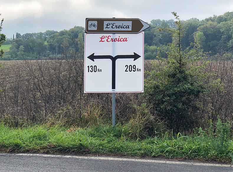 A sign at L'eroica for the 209 and 130km course