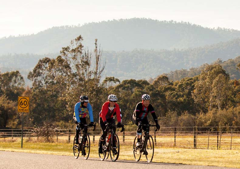 Four riders cycling in the Victorian countryside