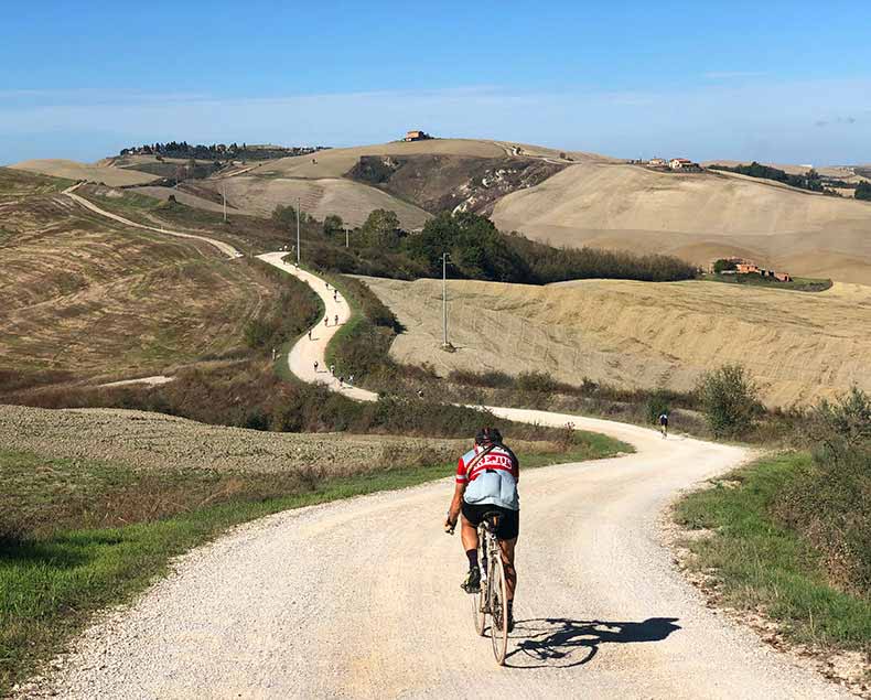 One cyclist on the strade bianche of Tuscany during L'eroiuca
