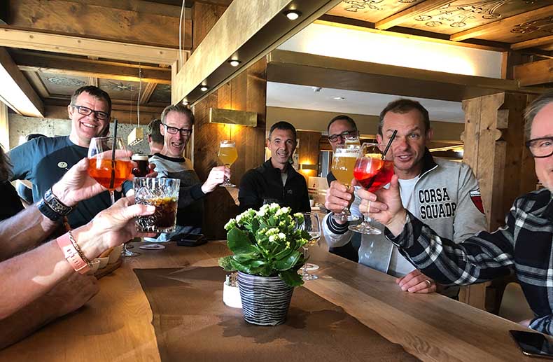 cyclist having aperitivo in the Dolomites