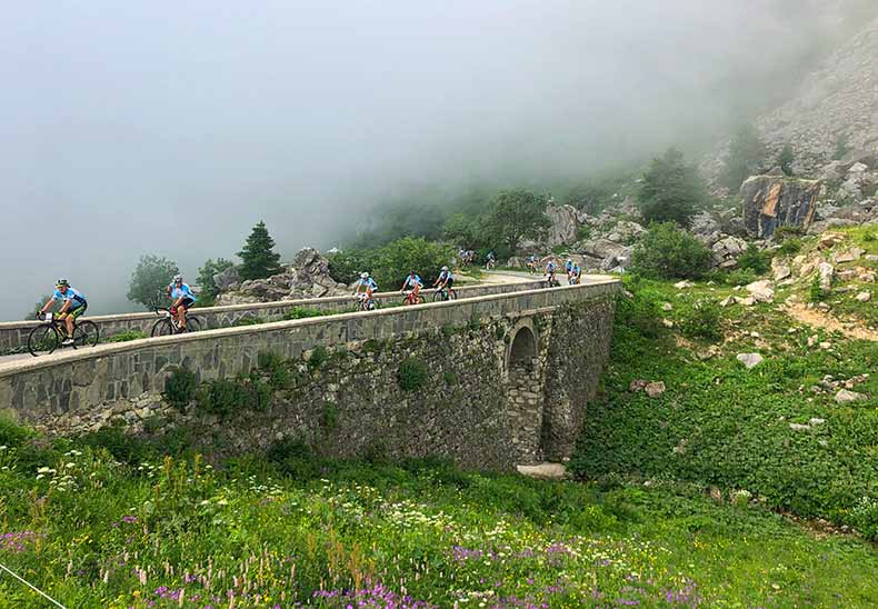 A group of riders climbing Colle Fauniera