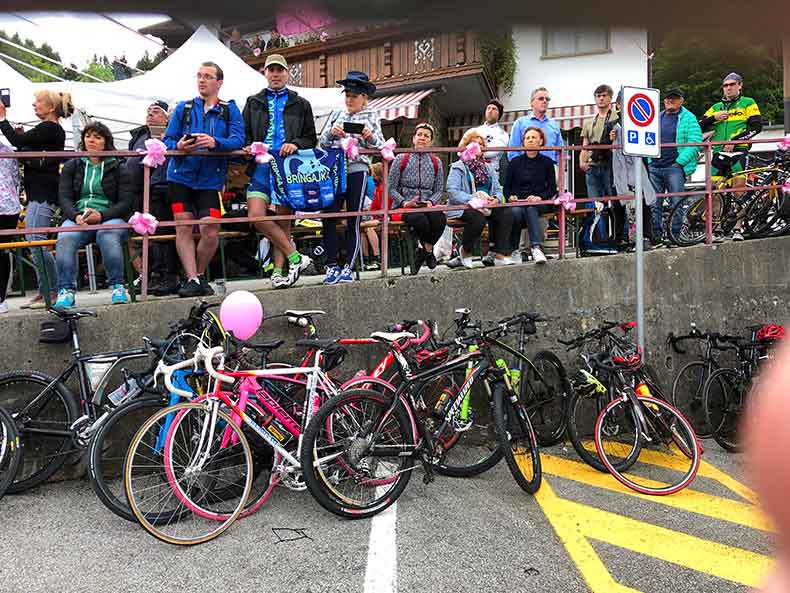 Bikes leaning against a wall a the Giro D'Italia race passes
