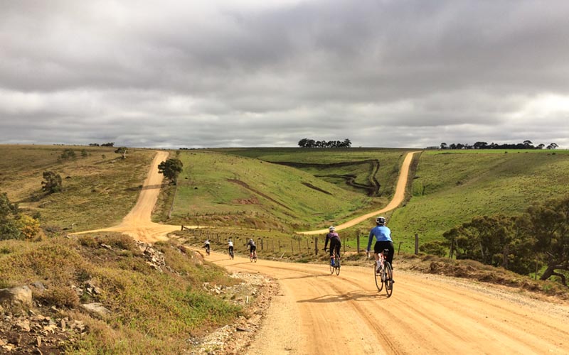 Cyclist riding on gravel near daylesford