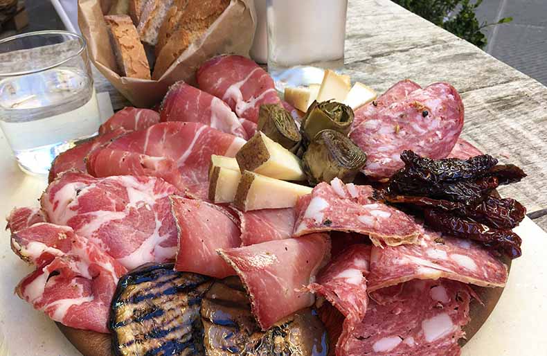 A plate of Tuscan salami and pecorino cheese