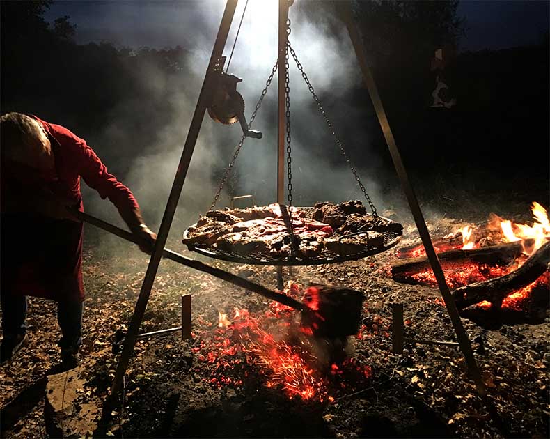 A mixed grill being cooked over charcoal in Tuscany