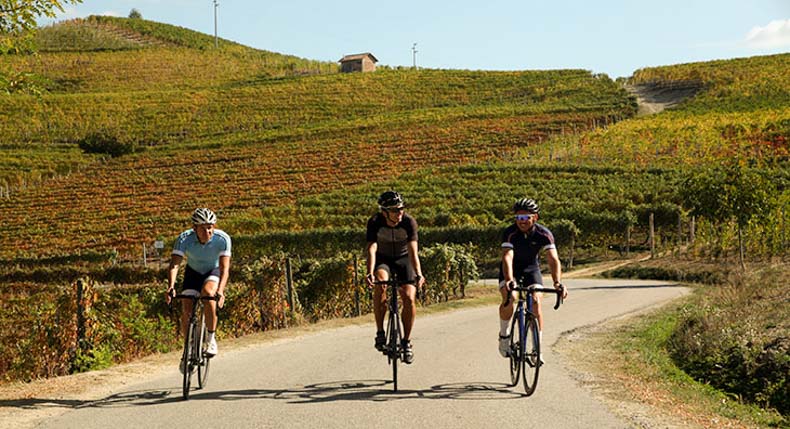 three cyclists riding in Italy