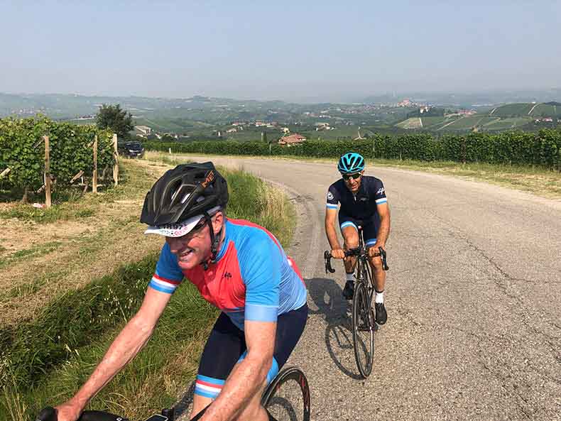 Two riders cycling in Le Langhe