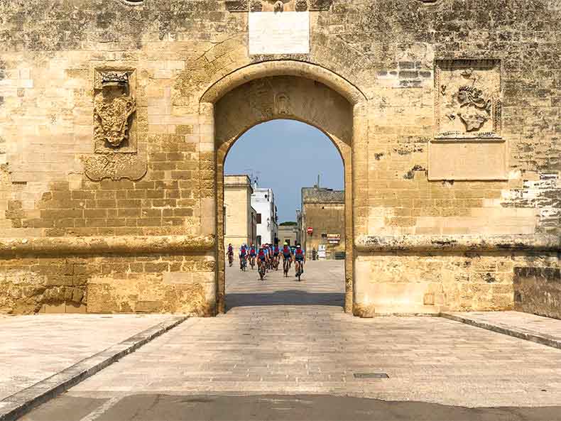 A group of cyclist riding through Puglia on a cycling holiday