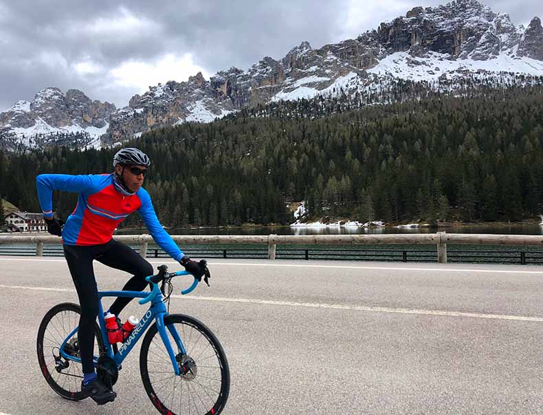 A man cycling in the dolomites